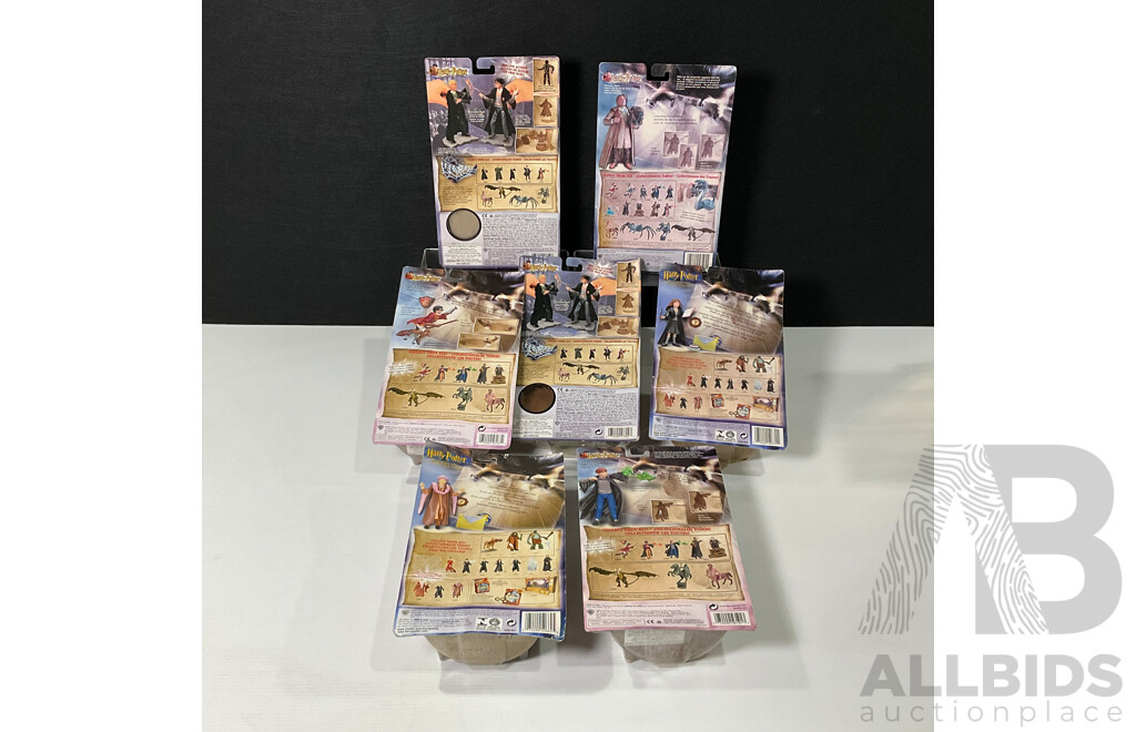 Collection of Seven Harry Potter Figures in Original Packaging