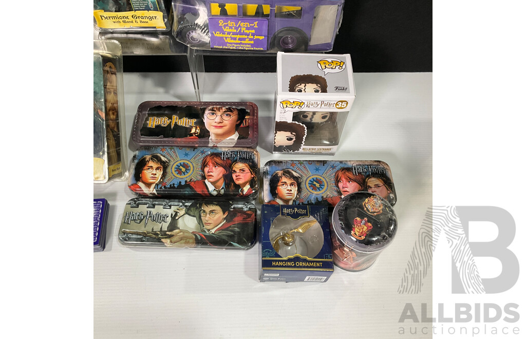 Collection of Harry Potter Paraphernalia Including Figures, Knight Bus, Pop Vinyl, Metal Tin, Money Box and More