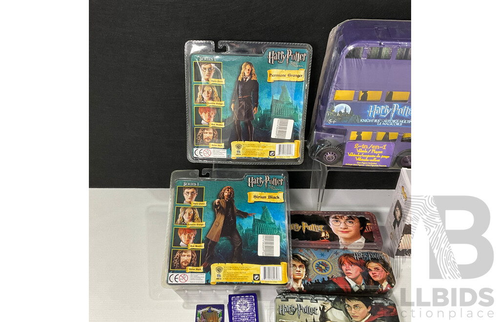 Collection of Harry Potter Paraphernalia Including Figures, Knight Bus, Pop Vinyl, Metal Tin, Money Box and More