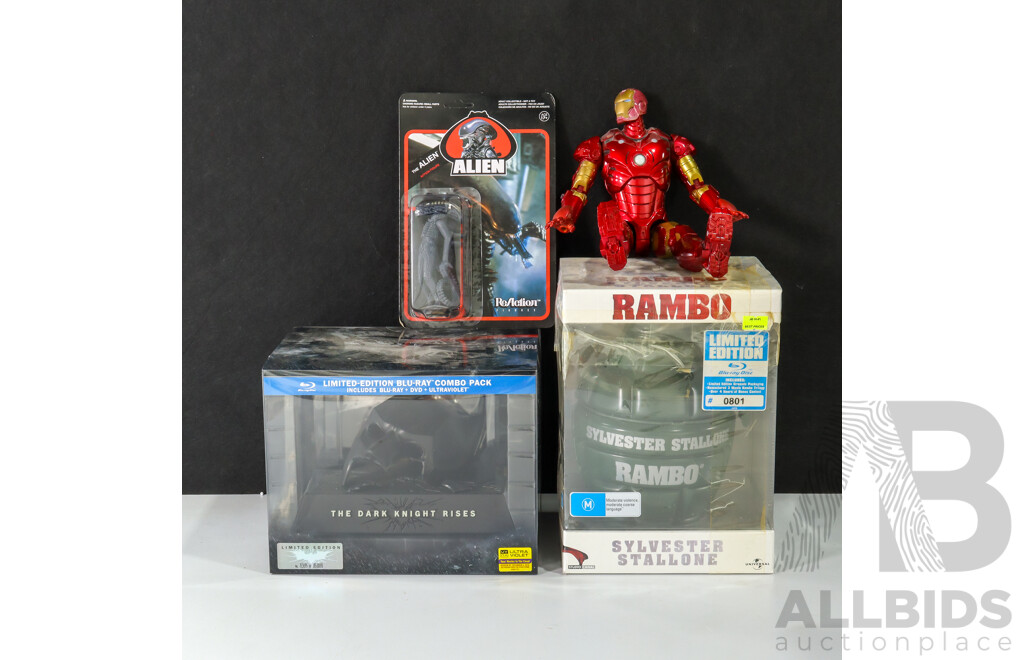 Collection of Limited Edition  Movie Paraphilia Including Batman Mask and Movie Set, Rambo Grenade, the Alien and Iron Man Figurines