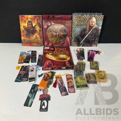 Collection of Lord of the Rings Paraphernalia in Original Packaging Including Pin Collection, Cards, Clock, Sticker Collection Book, Tin Container and More