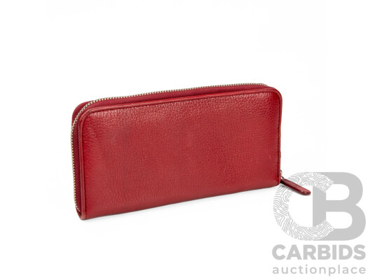 1662004 · Cherry Red Pebbled Leather Wrap Around Zip Wallet by Oroton