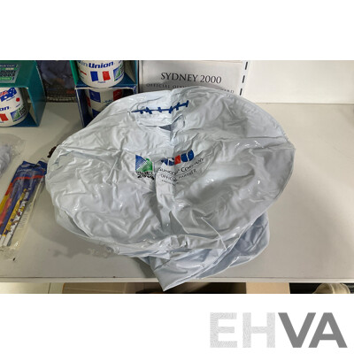 Collection of Sporting Goods Including Four 2003 Rugby World Cup Inflatable Footballs, Two Boxed Mugs, Boxed Sydney 2000 Mug and Pen Set, Twenty Five Olympic Poster Cards, 1996 Canberra Raiders Poster