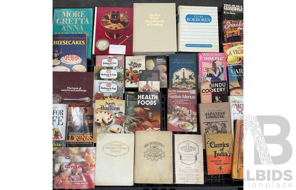 Collection of Vintage Cookbooks Spanning Various Cuisines and Baking Styles
