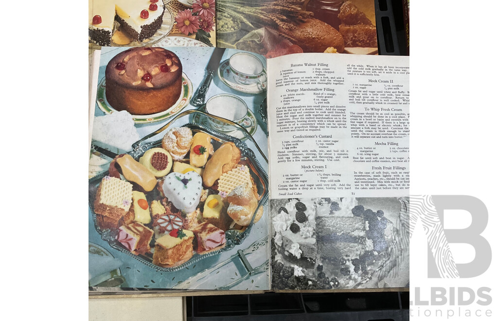 Collection of Vintage Cookbooks Spanning Various Cuisines and Baking Styles