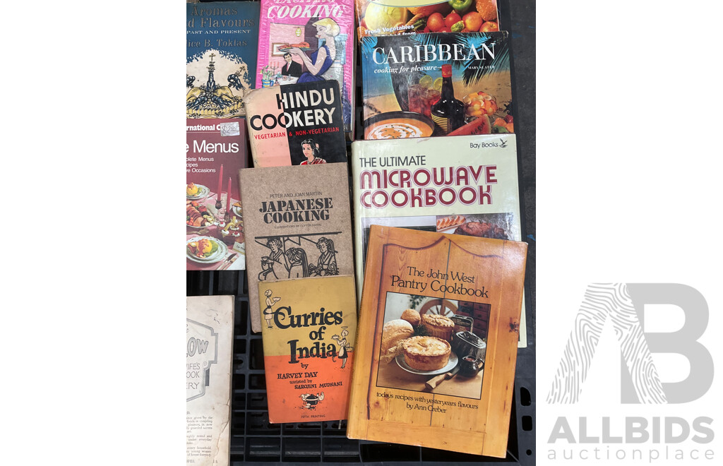 Collection of Vintage Cookbooks Spanning Various Cuisines and Baking Styles
