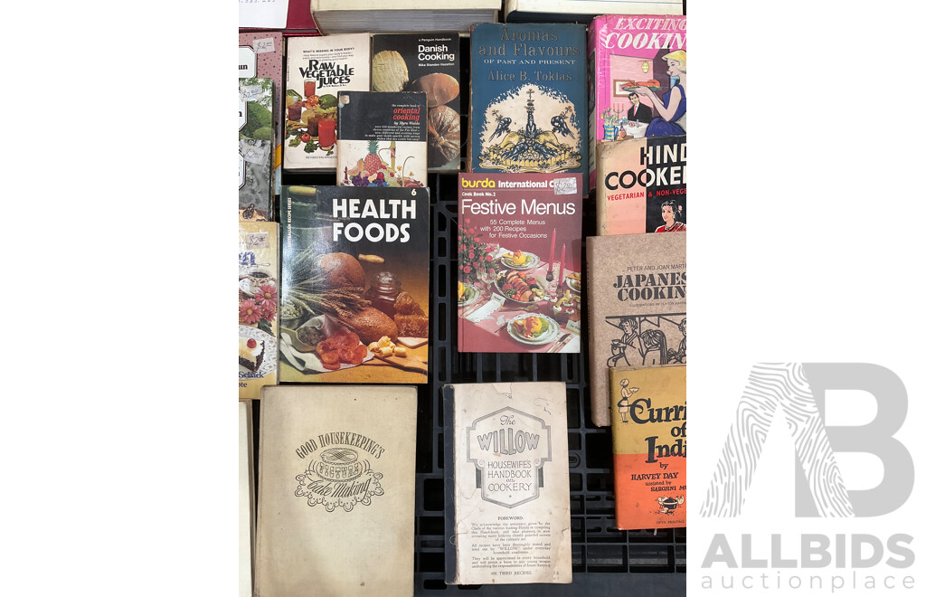Collection of Vintage Cookbooks Spanning Various Cuisines and Baking Styles