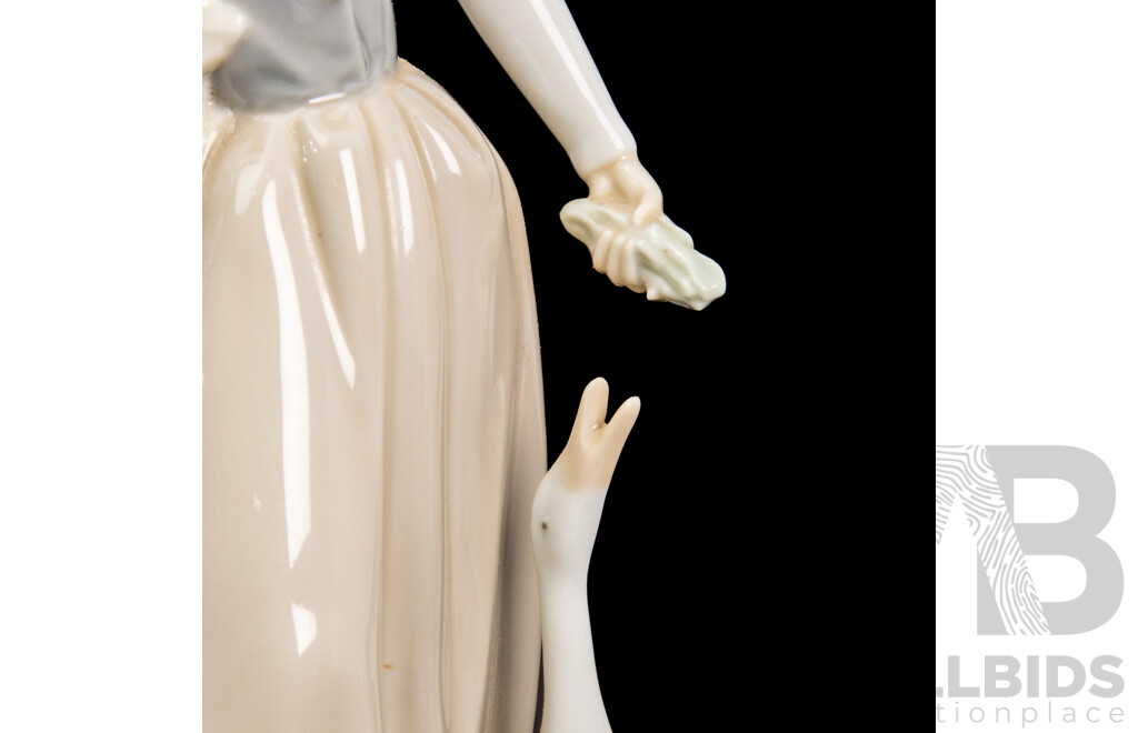 Two NAO by Lladro Porcelain Figurine of Girl Feeding Goose and Two Puppies