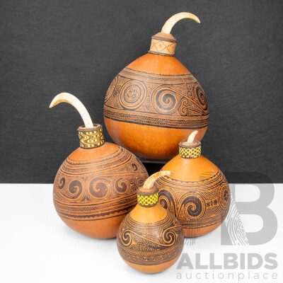 Collection of Four Graduated Massim Lime Beetle Gourds with Tusk Fitted Tips