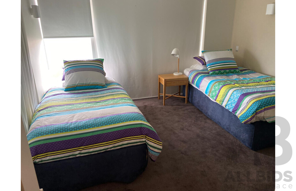 2 X Single Beds, 1 Has a Trundle Bed Undeneath, Bedside Table and Lamp - Plus All Linen Including Extra Set for Each as per Photos