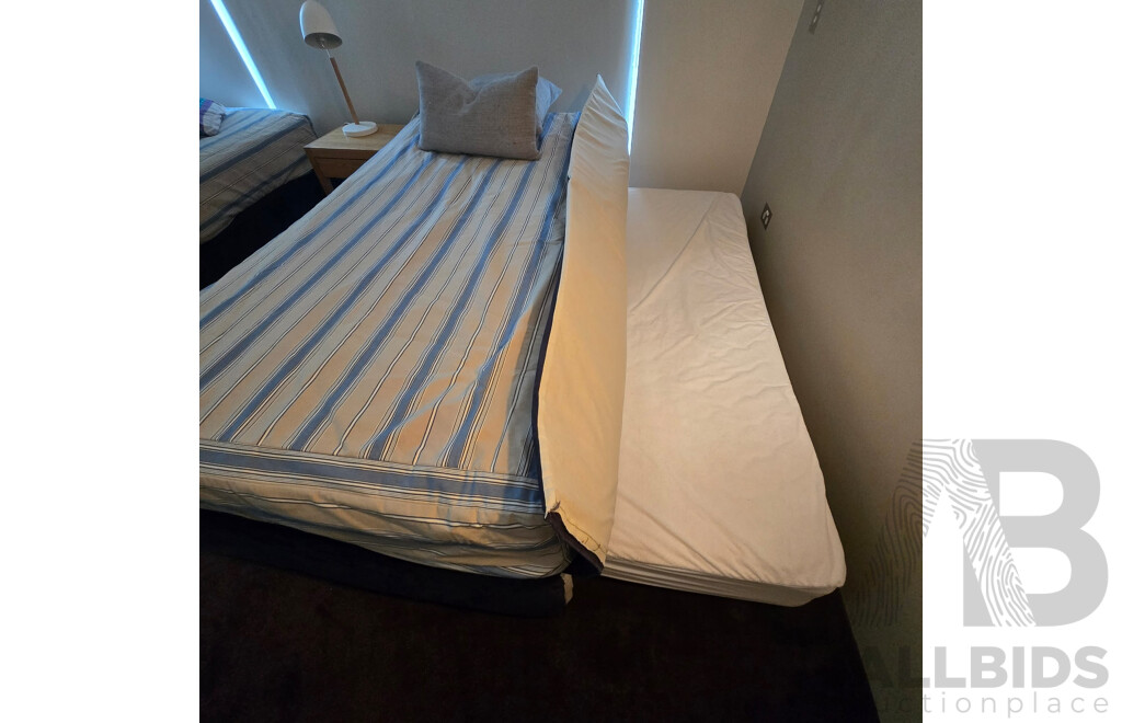 2 X Single Beds, 1 Has a Trundle Bed Undeneath, Bedside Table and Lamp - Plus All Linen Including Extra Set for Each as per Photos