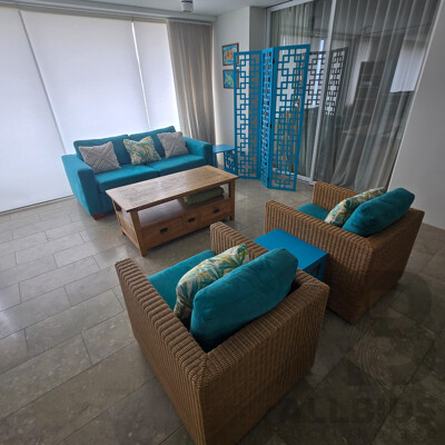 Contents of Middle Room Including Sofa Bed, Coffee Table/TV Stand, Lounge Chairs with 2 X Teal Side Tables, Teal Screen, Cushions and Throw Rug