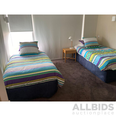 2 X Single Beds, 1 Has a Trundle Bed Undeneath, Bedside Table and Lamp - Plus All Linen Including Extra Set for Each as per Photos