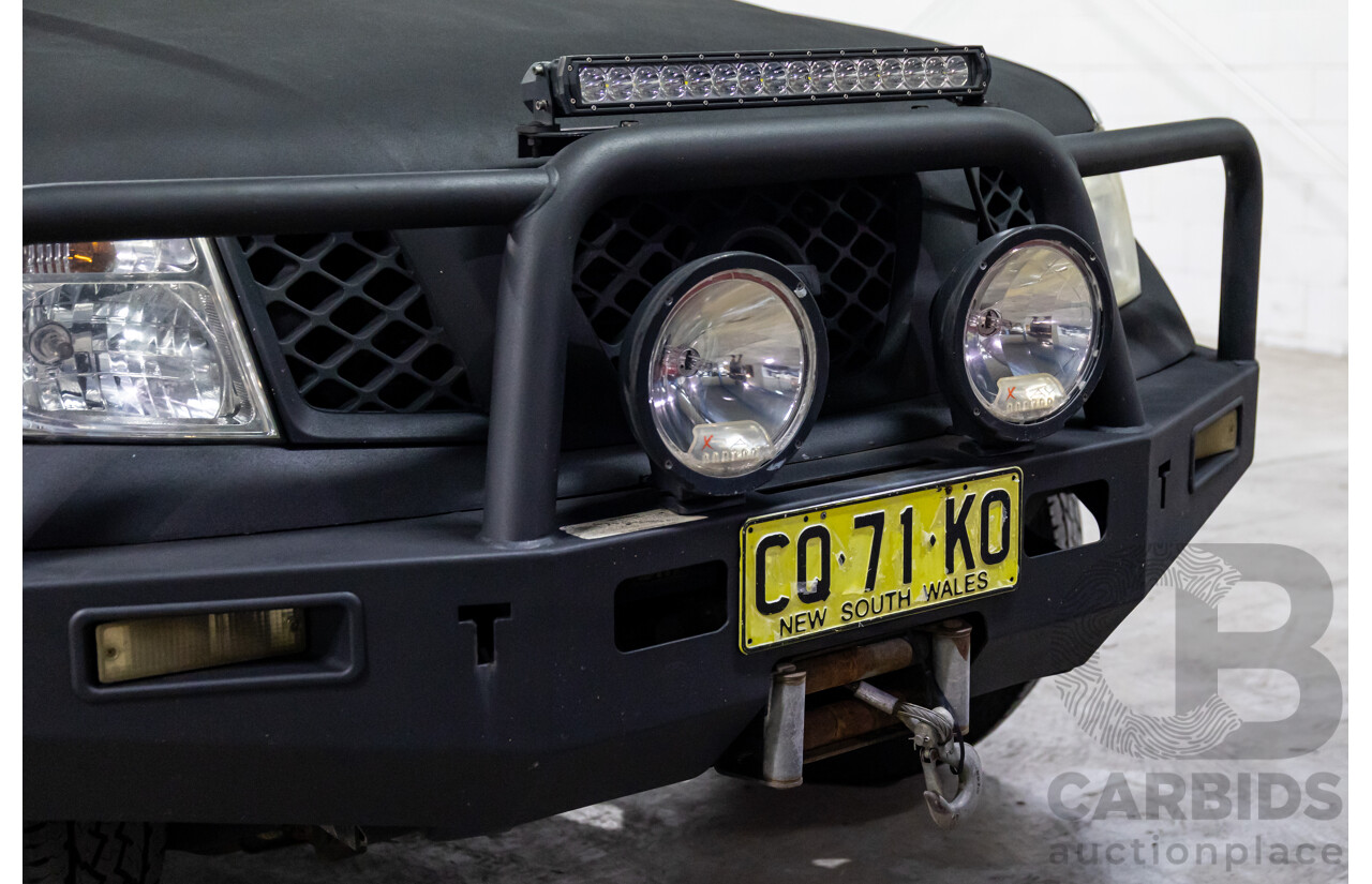 9/2009 Nissan Navara ST-X (4x4) D40 King Cab Chassis Slate Grey Metallic Turbo Diesel 2.5L