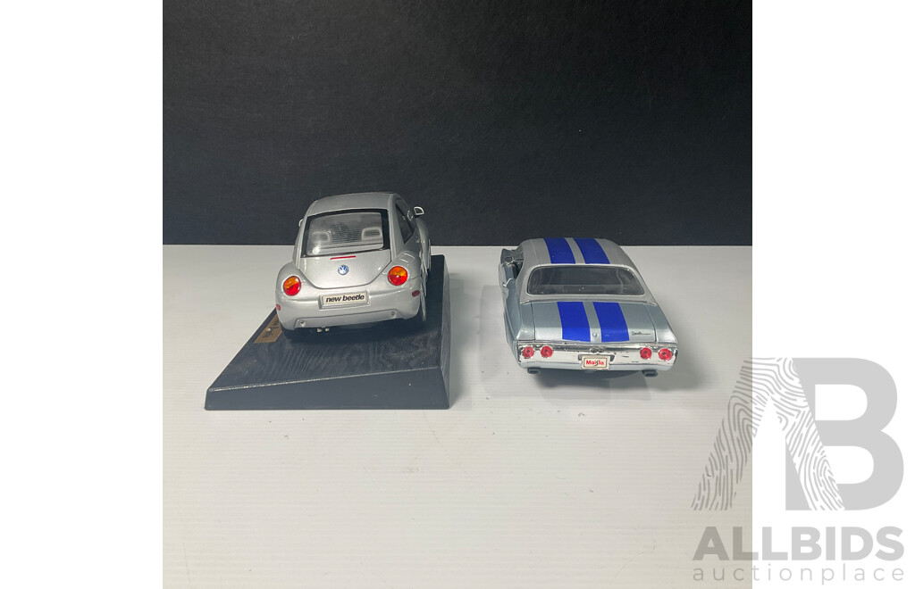 Pair of Maisto Cars Including Volkswagen New Beetle and Chevrolet Chevelle 1:18 Scale Models