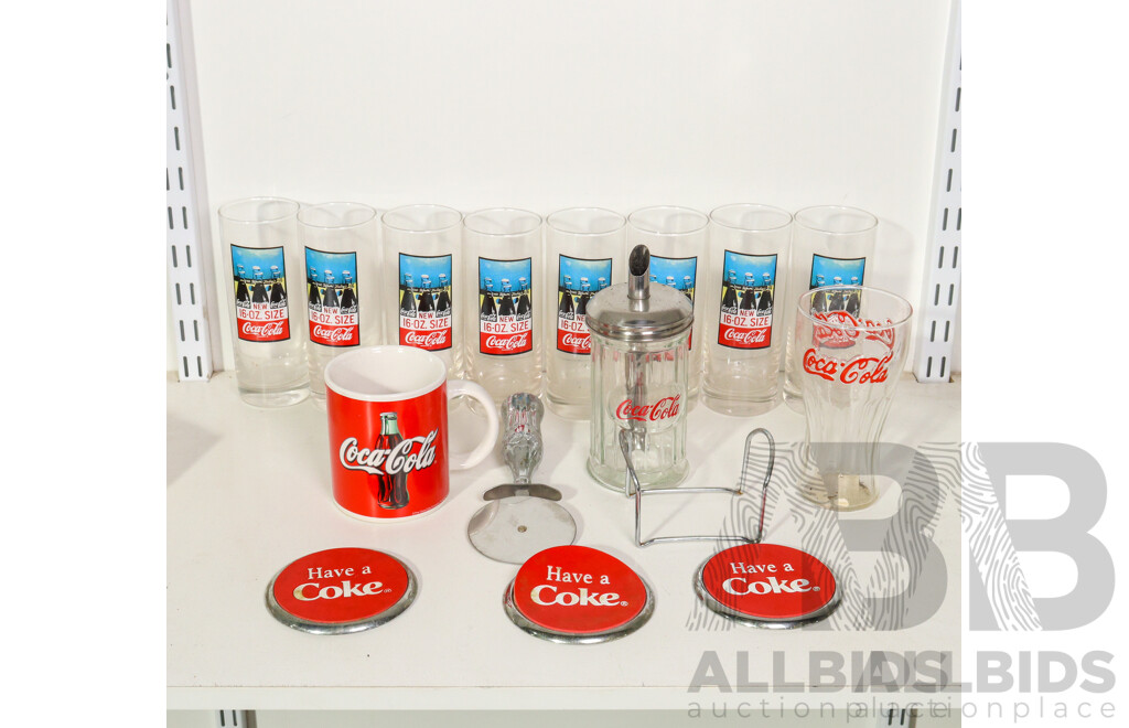 Collection of Coca Cola Paraphernalia Including Glass Cups, Pizza Cutter, Coasters and More