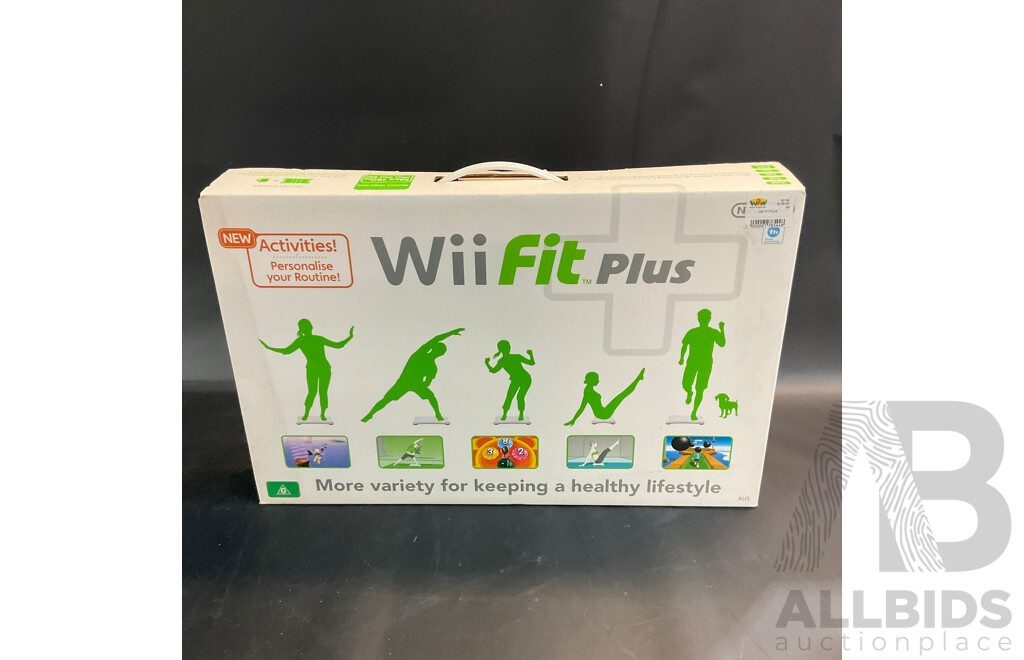 Nintendo Wii Console with Wii Fit Plus and MarioKart Game/Steering Wheel & Sports Pact 8 in 1 for Wii Sports Resort