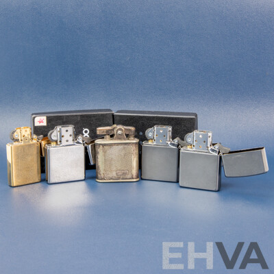 L61 - Collection of Four Zippo Flint Lighters and an Arlington