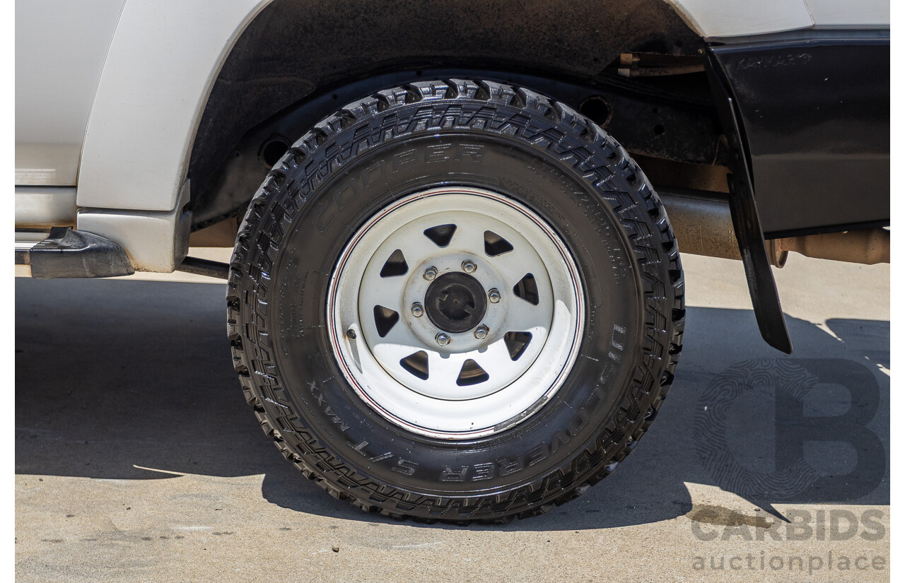 3/2010 Nissan Patrol ST (4x4) GU VI 4d Wagon Polar White Turbo Diesel 3.0L - 7 Seats