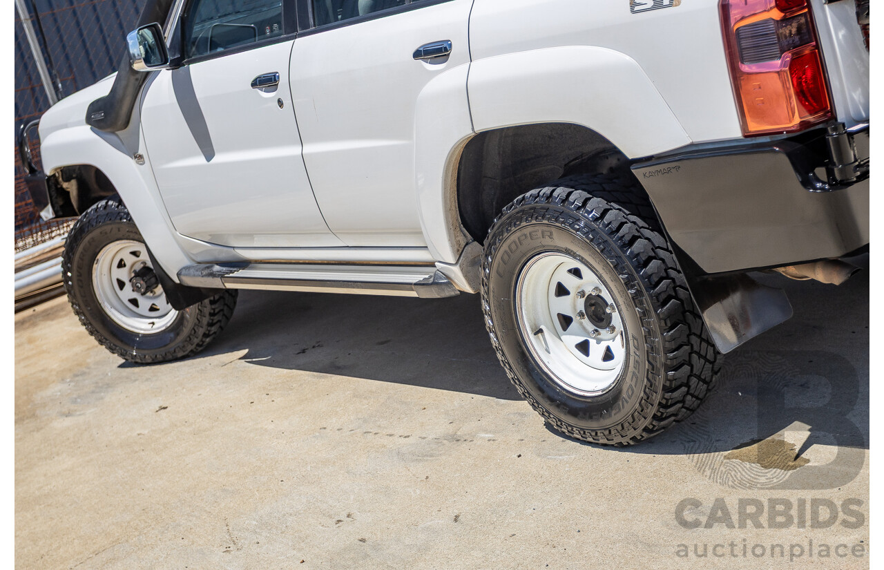 3/2010 Nissan Patrol ST (4x4) GU VI 4d Wagon Polar White Turbo Diesel 3.0L - 7 Seats