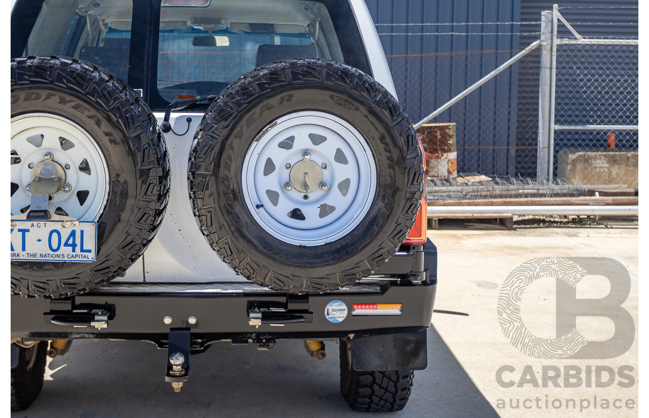 3/2010 Nissan Patrol ST (4x4) GU VI 4d Wagon Polar White Turbo Diesel 3.0L - 7 Seats