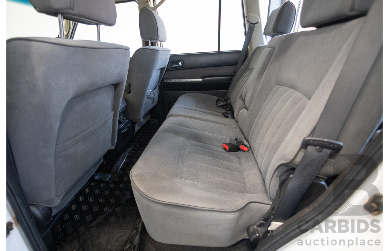 3/2010 Nissan Patrol ST (4x4) GU VI 4d Wagon Polar White Turbo Diesel 3.0L - 7 Seats