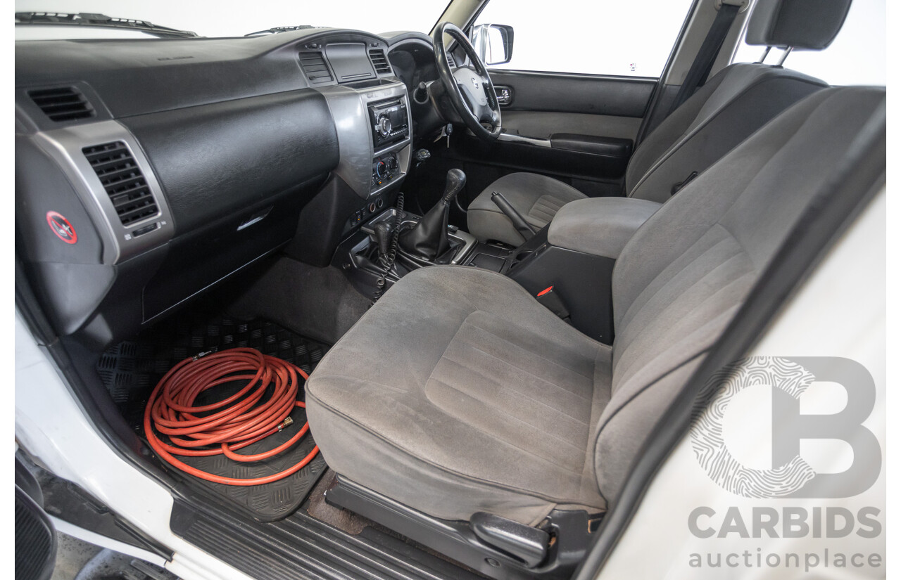 3/2010 Nissan Patrol ST (4x4) GU VI 4d Wagon Polar White Turbo Diesel 3.0L - 7 Seats