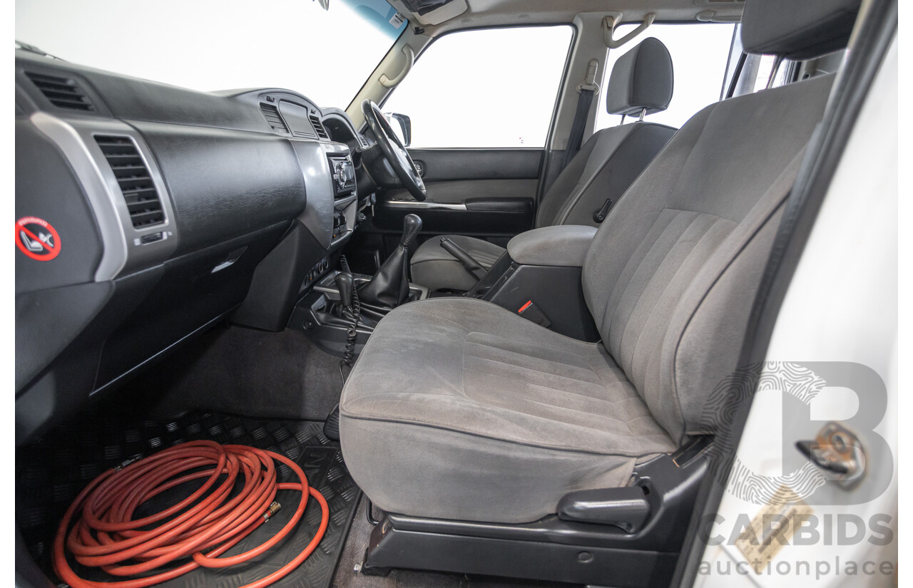 3/2010 Nissan Patrol ST (4x4) GU VI 4d Wagon Polar White Turbo Diesel 3.0L - 7 Seats