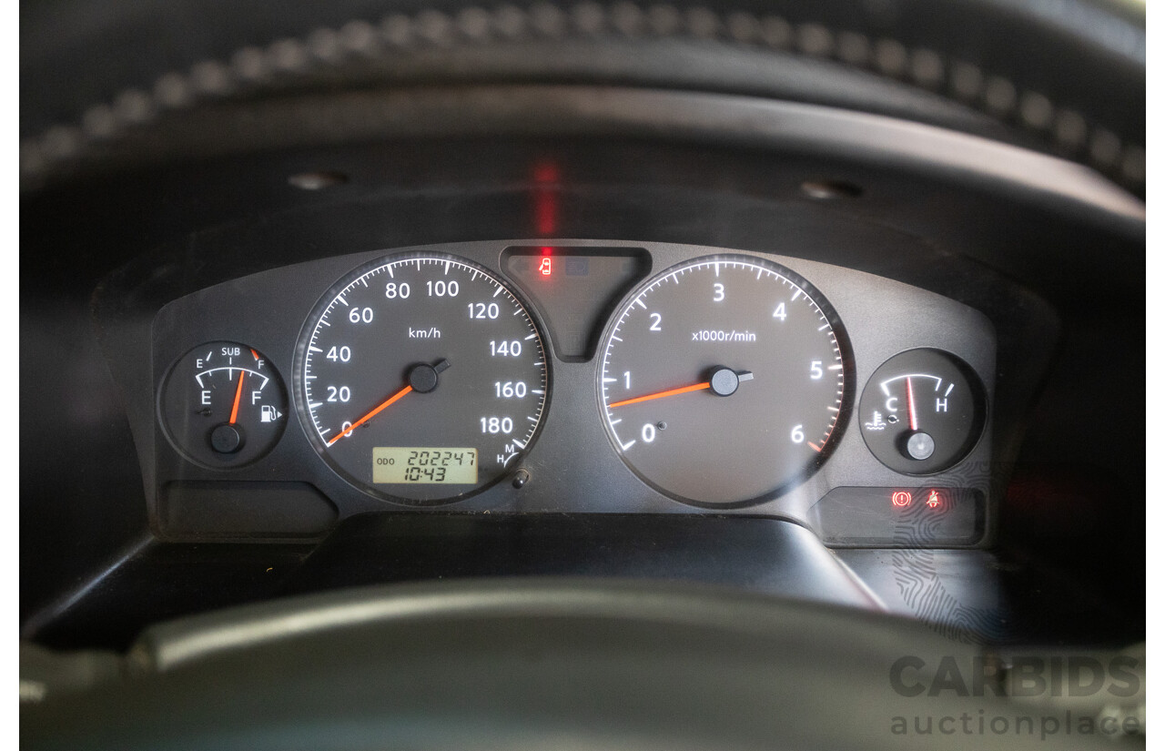 3/2010 Nissan Patrol ST (4x4) GU VI 4d Wagon Polar White Turbo Diesel 3.0L - 7 Seats