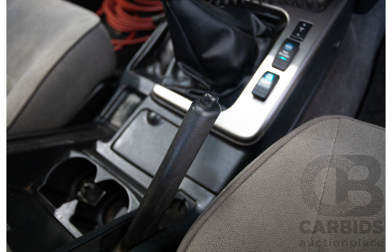 3/2010 Nissan Patrol ST (4x4) GU VI 4d Wagon Polar White Turbo Diesel 3.0L - 7 Seats