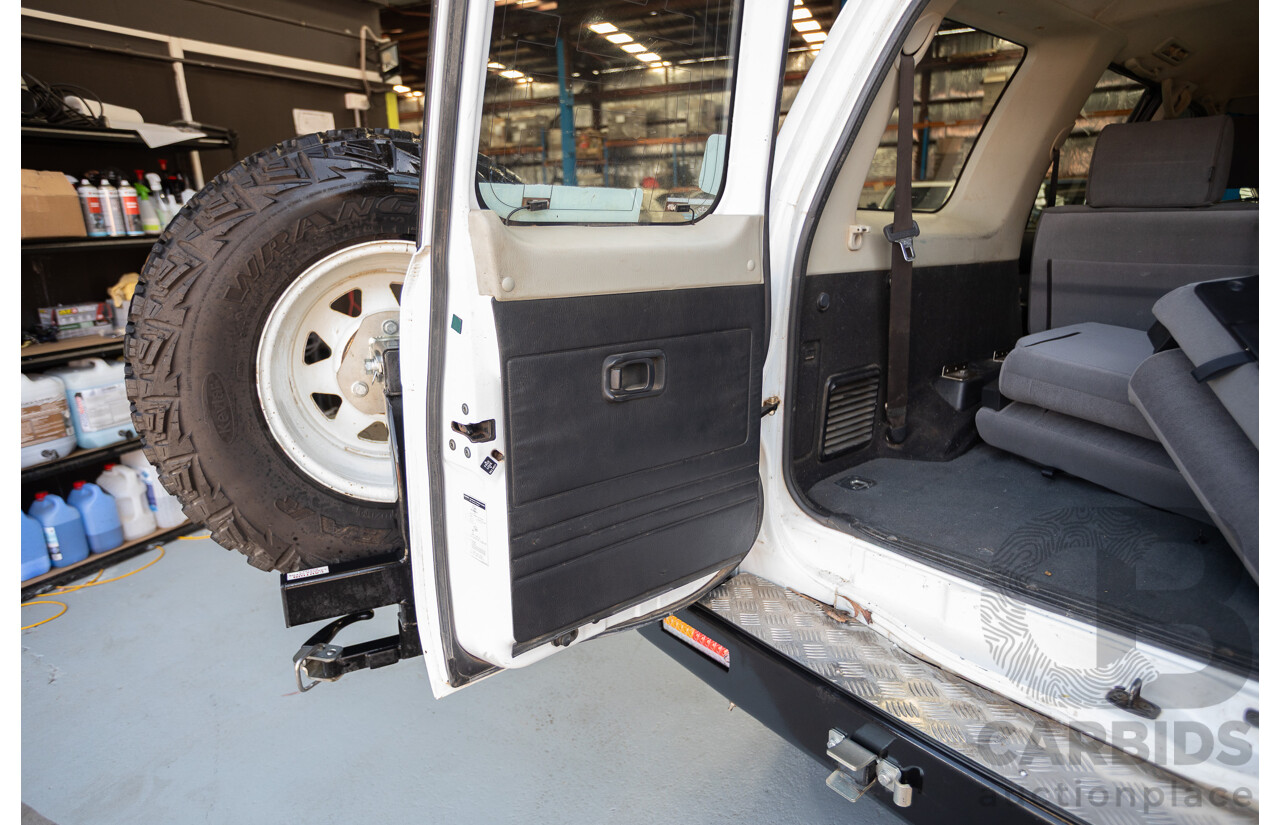 3/2010 Nissan Patrol ST (4x4) GU VI 4d Wagon Polar White Turbo Diesel 3.0L - 7 Seats