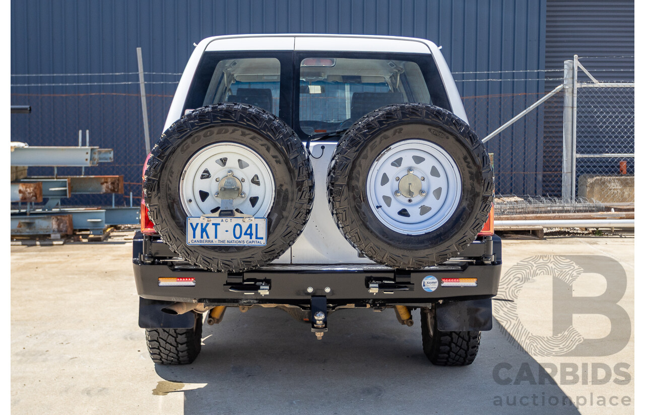 3/2010 Nissan Patrol ST (4x4) GU VI 4d Wagon Polar White Turbo Diesel 3.0L - 7 Seats