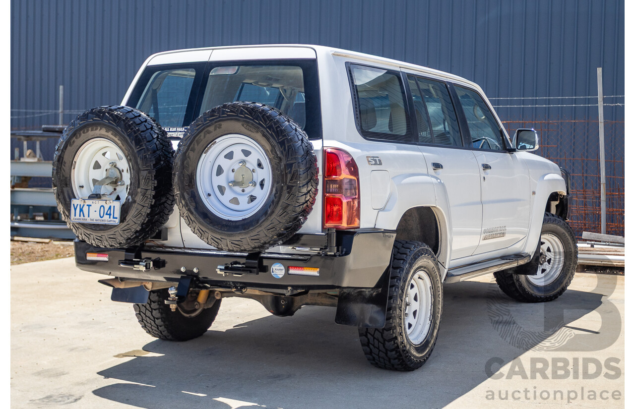 3/2010 Nissan Patrol ST (4x4) GU VI 4d Wagon Polar White Turbo Diesel 3.0L - 7 Seats