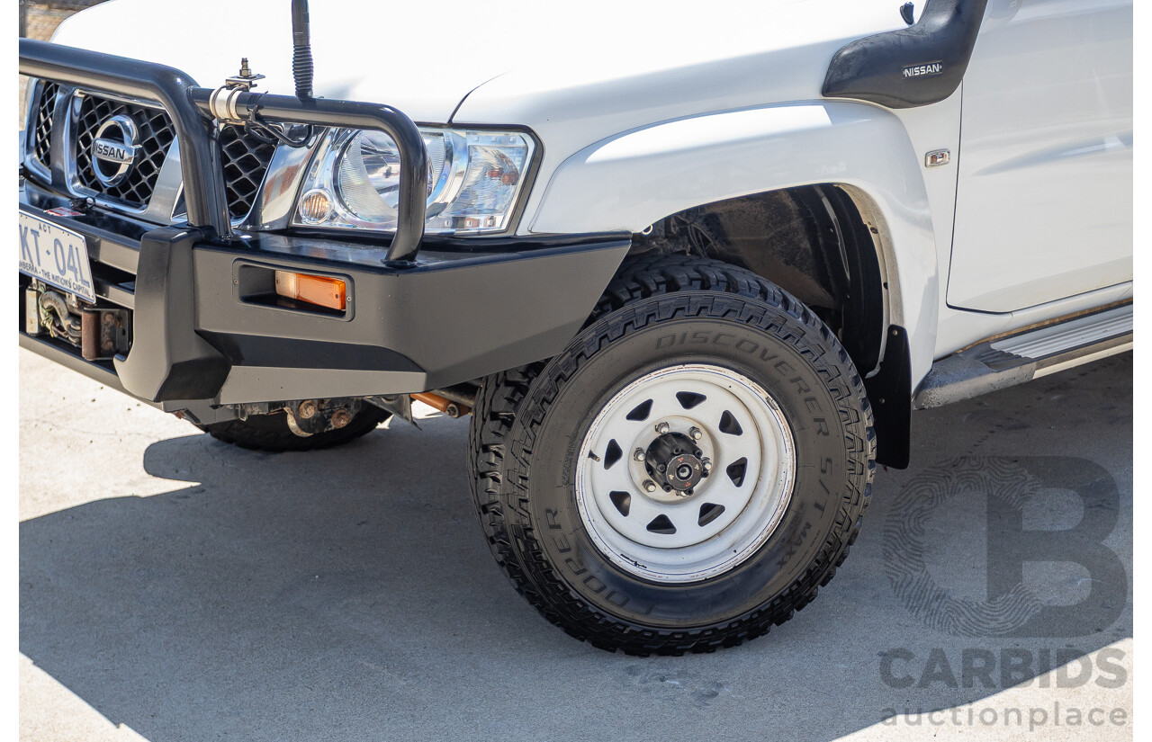 3/2010 Nissan Patrol ST (4x4) GU VI 4d Wagon Polar White Turbo Diesel 3.0L - 7 Seats