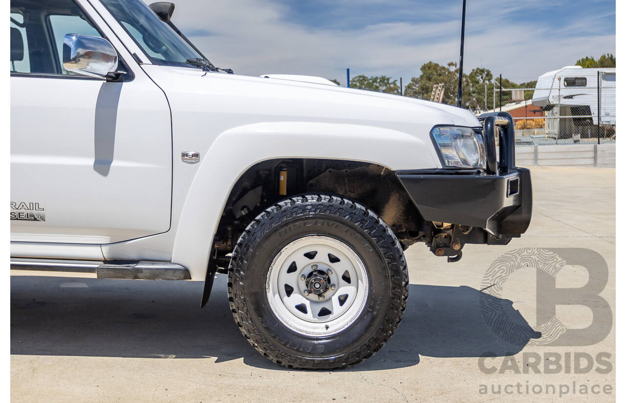 3/2010 Nissan Patrol ST (4x4) GU VI 4d Wagon Polar White Turbo Diesel 3.0L - 7 Seats