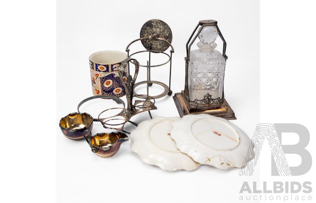 Collection of Three EPNS Tableware Pieces Inc Tantalus, Biscuit Barrel and Cruet Set.