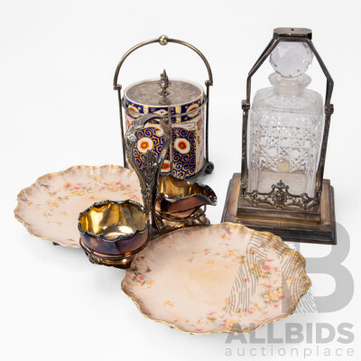 Collection of Three EPNS Tableware Pieces Inc Tantalus, Biscuit Barrel and Cruet Set.