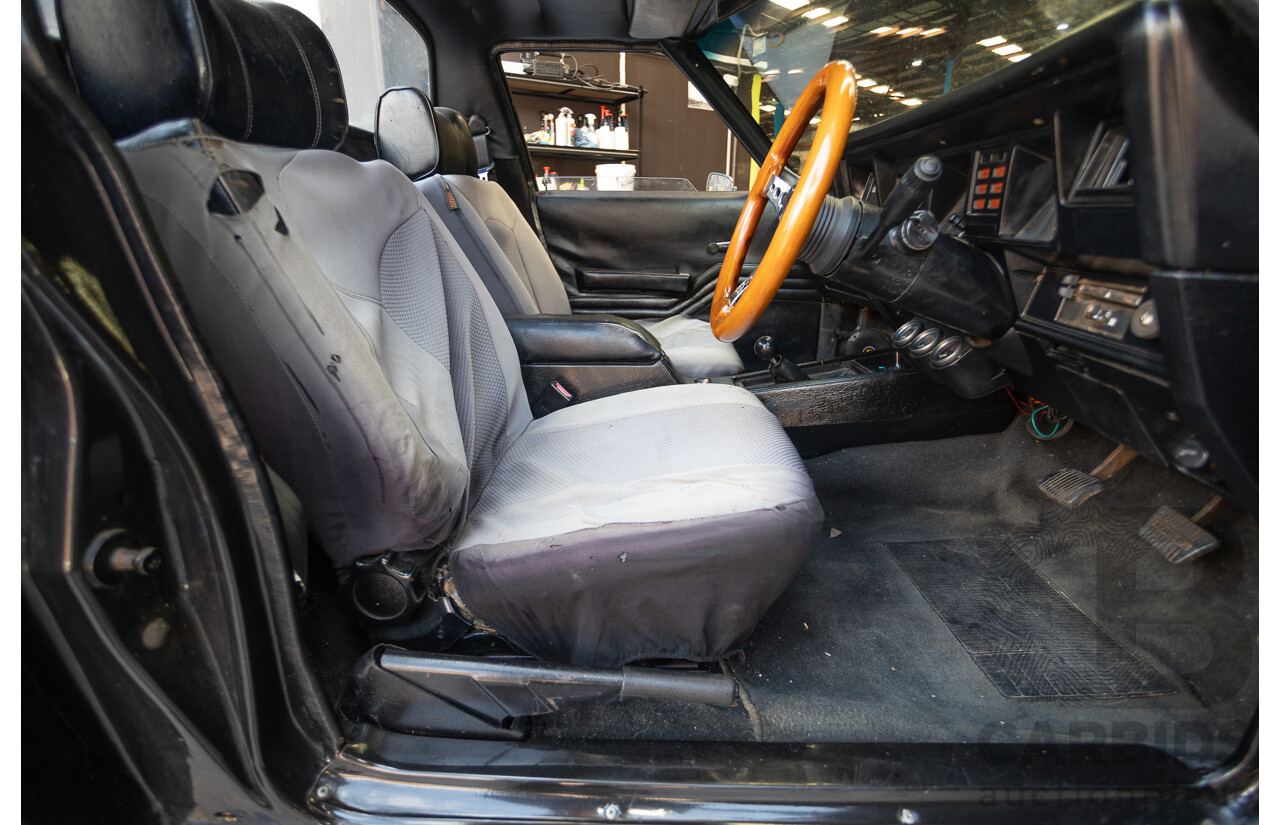 6/1981 Holden WB One Tonner 2d Trayback Utility Black V8 4.2L