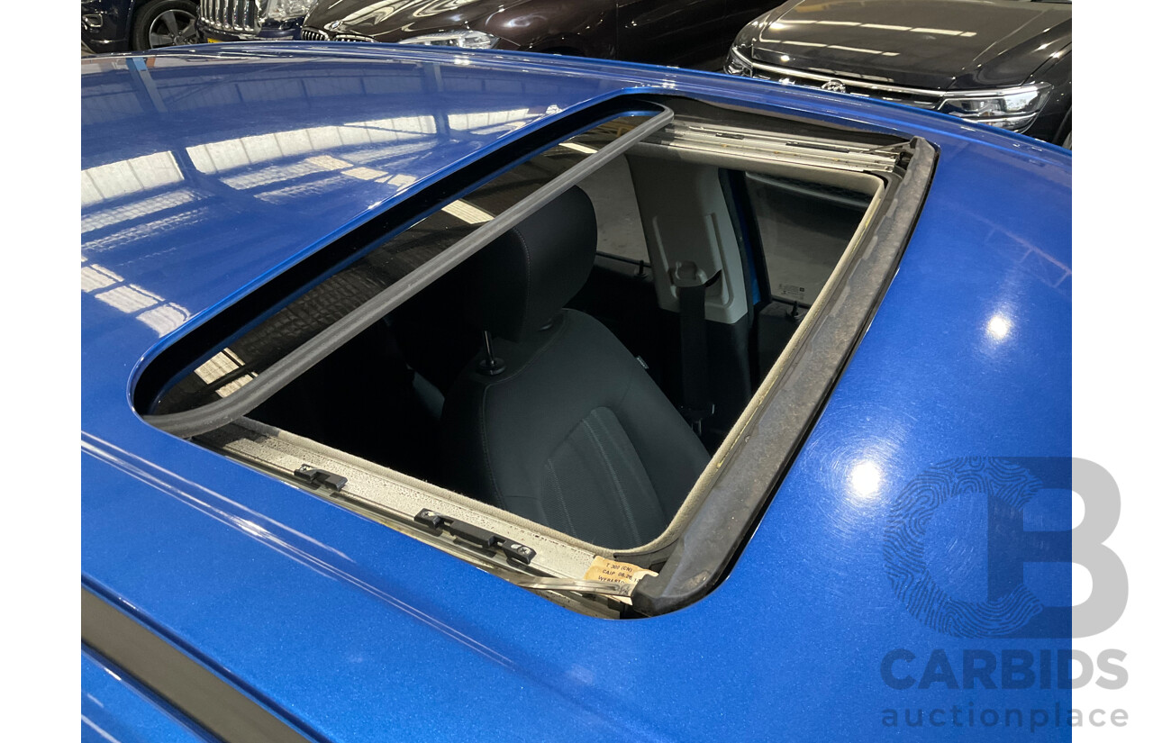 10/2014 Holden Barina CD TM MY14 4d Sedan Boracay Blue Metallic 1.6L