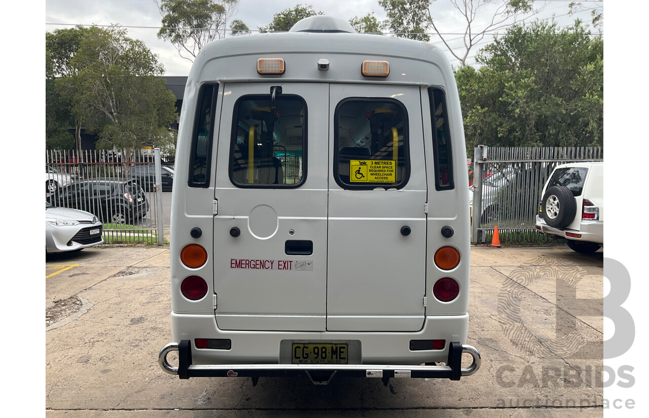 10/2015 Mitsubishi Rosa BE600 18 Seater 3d White Turbo Diesel 4.9L - Custom Wheelchair Lift