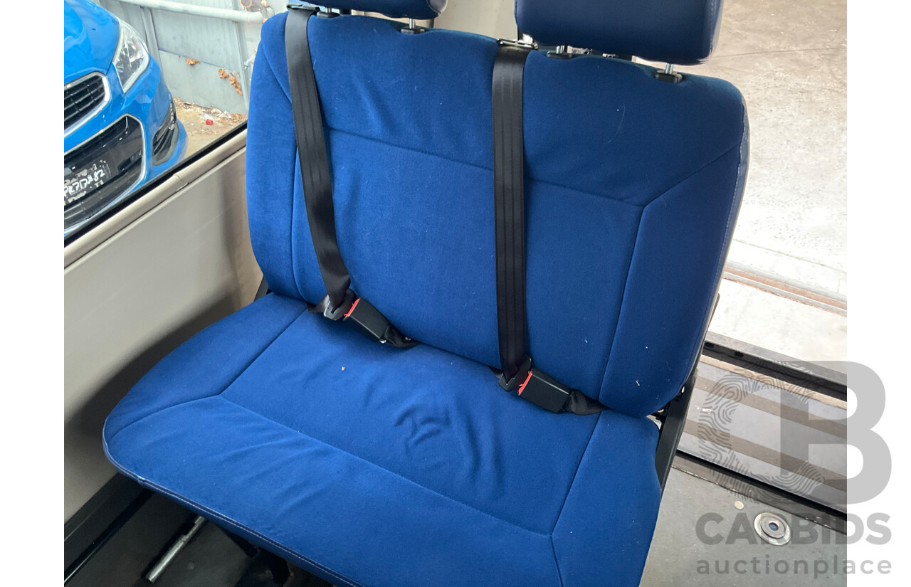 10/2015 Mitsubishi Rosa BE600 18 Seater 3d White Turbo Diesel 4.9L - Custom Wheelchair Lift