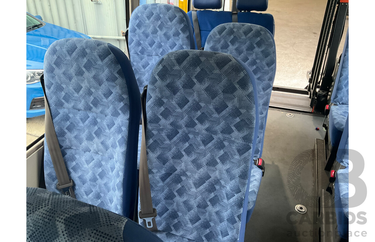 10/2015 Mitsubishi Rosa BE600 18 Seater 3d White Turbo Diesel 4.9L - Custom Wheelchair Lift