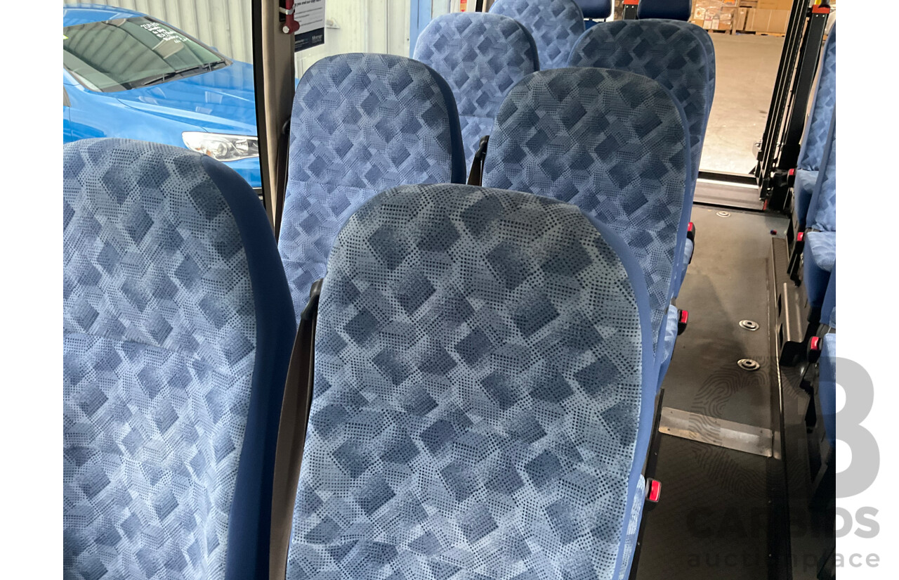 10/2015 Mitsubishi Rosa BE600 18 Seater 3d White Turbo Diesel 4.9L - Custom Wheelchair Lift