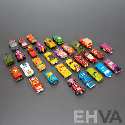 Thirty Vintage Matchbox Vehicles Including Mazda RX 500, Freeman Inter City Commuter, Rod Tractor, Pontiac Firebird, Team Matchbox F1, Peanut Scout Road Dragster and More