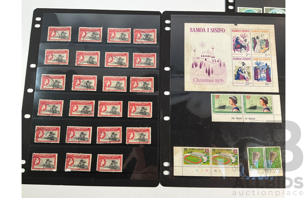 Collection of Vintage International Mint and Cancelled Stamps Including British Solomon Islands, Norway, Netherlands, Nigeria, Australia, Ireland, Gilbert & Ellice Islands, Samoa, Dominica, Uganda, Tanganyika, Bahamas, Seychelles