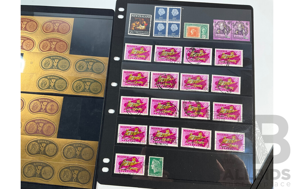 Collection of Vintage International Mint and Cancelled Stamps Including British Solomon Islands, Norway, Netherlands, Nigeria, Australia, Ireland, Gilbert & Ellice Islands, Samoa, Dominica, Uganda, Tanganyika, Bahamas, Seychelles