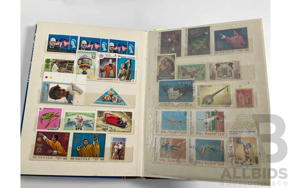 Four Albums of International Vintage Stamps Including Spain, Canada, Mauritius, Philippines, Monaco, Hong Kong, Netherlands, Zambia, Tonga and More