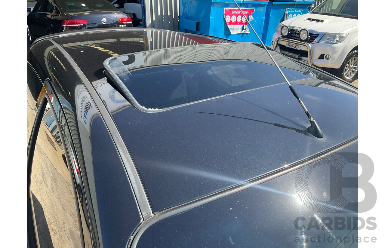 2/2010 Holden Barina TK MY10 3d Hatchback Black 1.6L