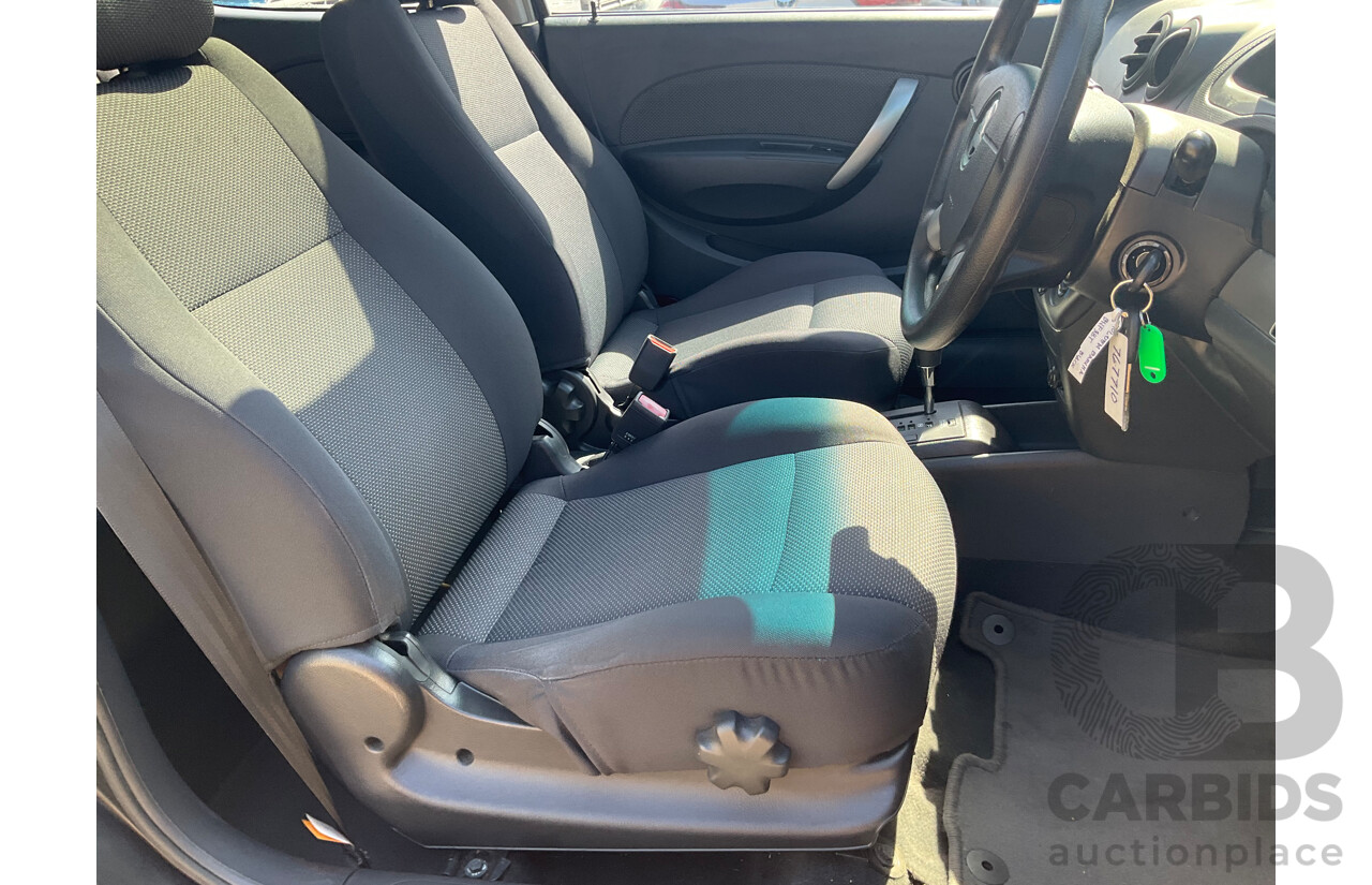 2/2010 Holden Barina TK MY10 3d Hatchback Black 1.6L