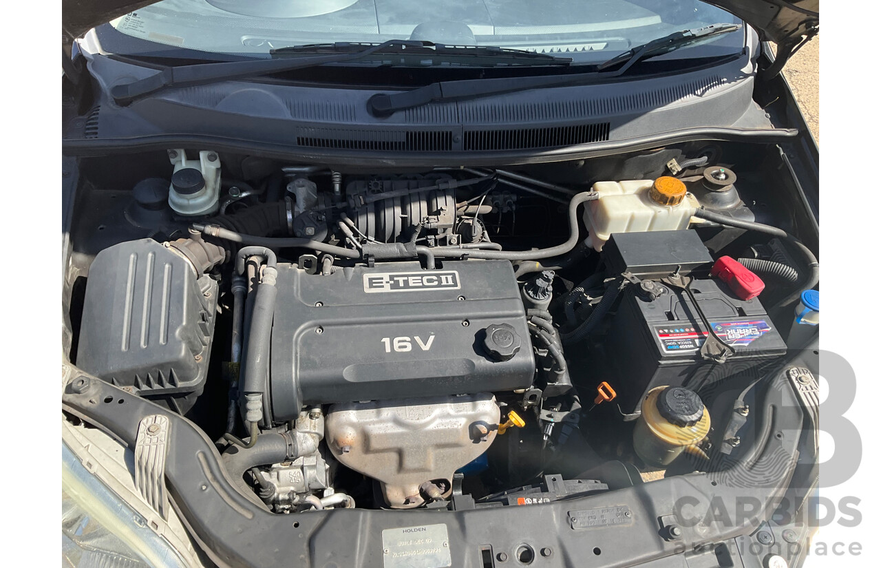 2/2010 Holden Barina TK MY10 3d Hatchback Black 1.6L